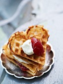 Creamy Swedish waffles with cream and strawberry jam