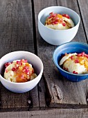 Honey ice cream with citrus fruit and pomegranate seeds
