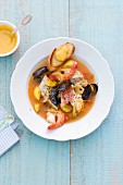Bouillabaisse on a white plate