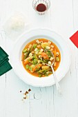 Minestrone in a white bowl