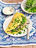 Omelette with peas, mange tout, ham and Pecorino