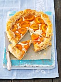 Puff pastry cheesecake with apricots, sliced