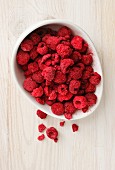 A bowl of freeze-dried raspberries (seen from above)