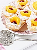 Vanilla pastries with fruit and icing sugar
