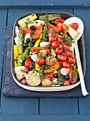Roasted vegetables: potatoes, tomatoes, courgettes and asparagus