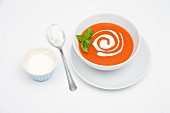 Cream of tomato soup with sour cream and basil