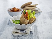Pita breads stuffed with mince sauce, peppers and lettuce