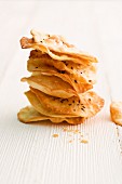 A stack of thin mini unleavened caraway bread