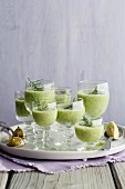 Cucumber and Riesling shots in glasses on a tray