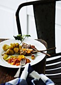 Minced meat kebabs with potatoes and relish