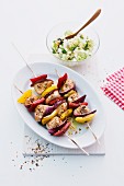 Turkey skewers with peppers and onions, couscous salad with cucumber and sheep's cheese