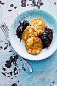 Pear and potato pancakes with blackberry sauce