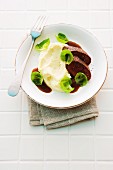 Mashed potatoes and celery with saddle of venison and Brussels sprouts