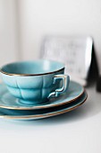 Light blue, retro teacup and two saucers