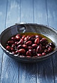 Spanish Empeltre olives with olive oil in a rustic dish