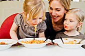 A family eating spaghetti together