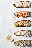 A selection of fish spreads on toasted brown bread