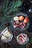 Blue cheese, cured meat and a fruit plater (pears and pomegranates)