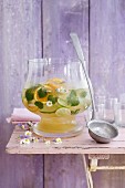 Herb punch with orange and lime slices