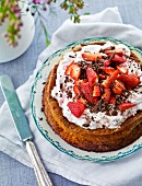 Strawberry cake with cream and grated chocolate