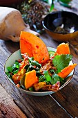 Mixed leaf salad with pumpkin and bacon
