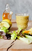 A vegetable smoothie made with lettuce, avocado and celery