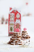 Gingerbread biscuit trees decorated with icing sugar and peppermint bonbons