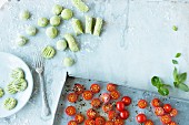 Herb gnocchi with oven roasted tomatoes being made