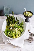 Baked green asparagus with wild herbs and capers