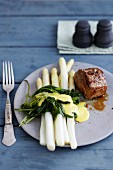 Veal fillet with white asparagus and woodruff-Hollandaise sauce