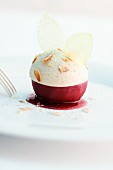 A poached mulled wine apple with gingerbread mousse