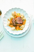 Veal fillet with braised orange-carrots, gnocchi and spiced crumbs