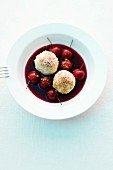 Sour cherry soup with quark dumplings and gingerbread crumbs