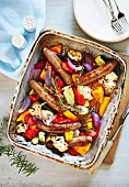 Oven-roasted vegetables with sausages