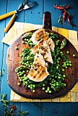 Grilled chicken breast with peas, asparagus and spinach
