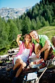 A couple having a picnic in the mountains (Austria)