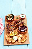 Grilled vegetables and meat with baked potatoes