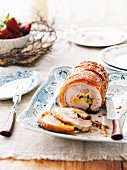 Roast pork roulade filled with couscous, apricots and pistachios