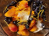 Apricots and blueberries with sugar, lemon zest and vanilla pods