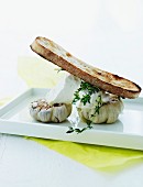 Grilled bread with roasted garlic and goat's cream cheese