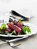 Bresaola rolls with a herb cream filling