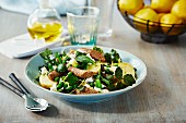 Mint salad with lamb sausage, peas and potatoes