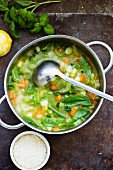 Vegetable soup with parmesan and basil