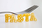 Letter-shaped pasta spelling the word 'Pasta'
