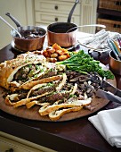 Leg of lamb wrapped in bread with vegetables