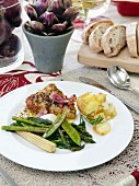Marinated chicken with green vegetables and potatoes