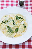 Round ravioli with a ricotta filling in sage butter