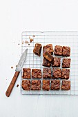 Brownies with chopped nuts on a wire rack