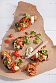 Crostini with tomatoes, bacon and goat's cheese