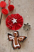 Gingerbread angel decorated with icing sugar inside the cookie cutter